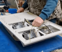 Lehmann IT preparing the door of the super sound‑insulated 19″ server cabinet with ultra‑quiet fans and acoustic insulation